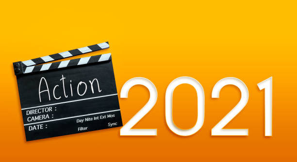istock Action text title on film slate and new 2021. 1289317463