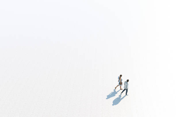 istock Young Stylish Caucasian Couple Walking, High Angle View, Isolated Against White, Unrecognizable. 1289318445