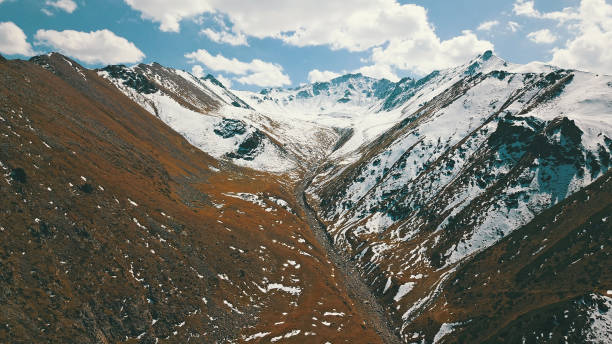 istock Autumn mountains covered with snow in places 1289319208