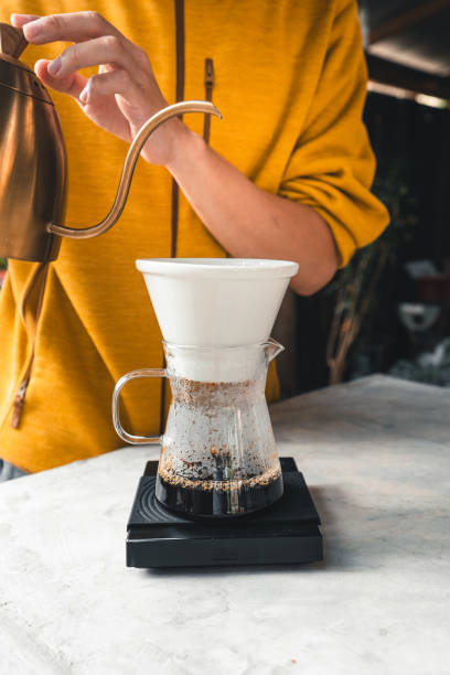 istock Drip coffee, barista pouring water on coffee ground with filter,brewing coffee 1289321034