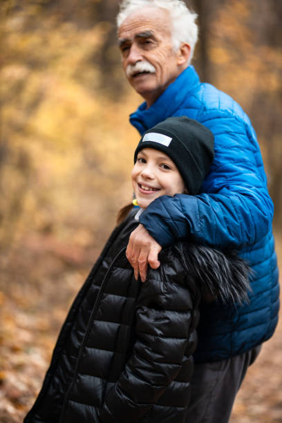 istock Devoted grandpa taking his granddaughter for a walk 1289321925