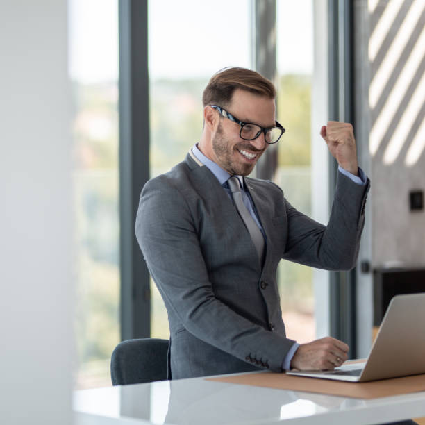 istock Businessman's Success in modern office 1289321993