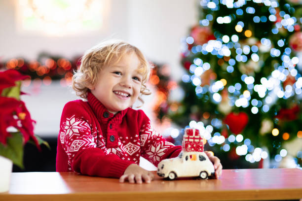 istock Child with Christmas present. Kid with Xmas gift. 1289322802