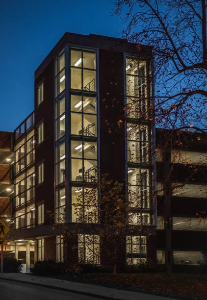 istock Brightly lit parking garage building 1289323266