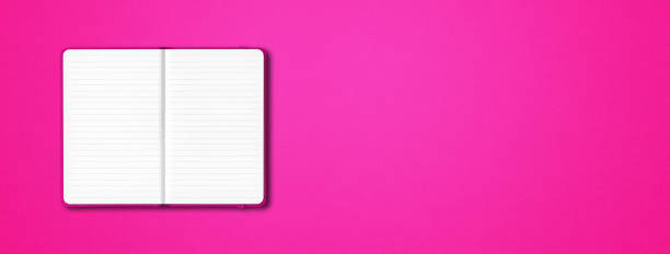 istock Pink open lined notebook isolated on colorful background. Horizontal banner 1289325214