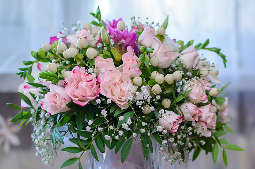 Beautiful pink, purple Lisianthus bouquet in full bloom with green leaves