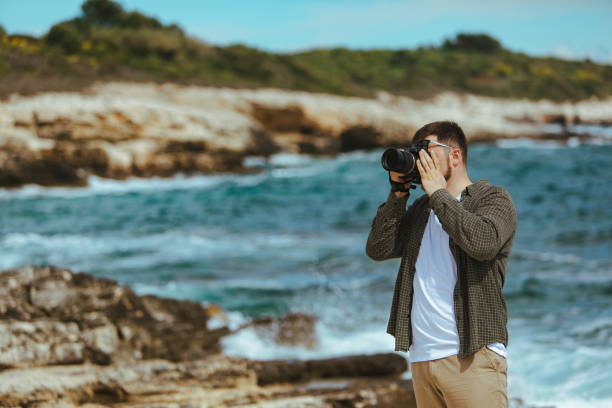 istock professional photographer shooting seascape 1289329535