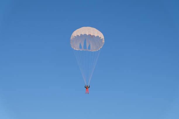 istock Skydiving. A military parachute is in the sky. 1289330635