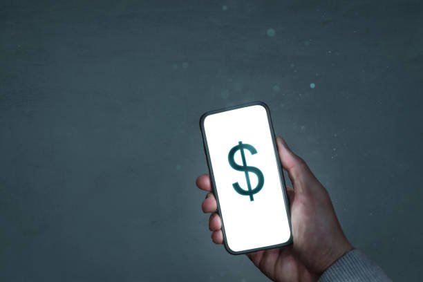 istock Smartphone screen showing a dollar sign 1289331224