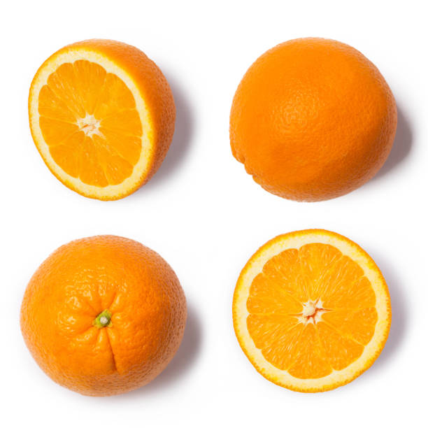 istock Oranges whole and sliced on white background in studio 1289331350