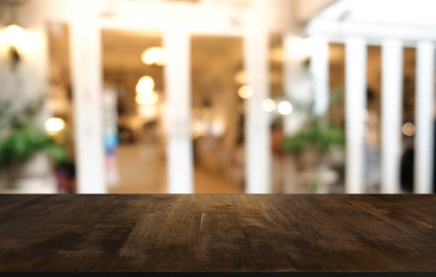 istock Wood Table Top in Blur Background room interior with empty copy space. 1289334896