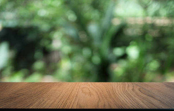 istock Wood Table Top in Blur Background room interior with empty copy space. 1289339062