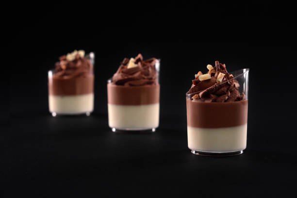 istock Glasses with panna cotta and whipped cream. 1289340573