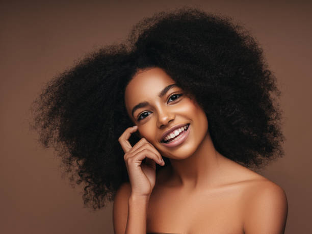 istock Beautiful smiling girl with curly hairstyle 1289340814