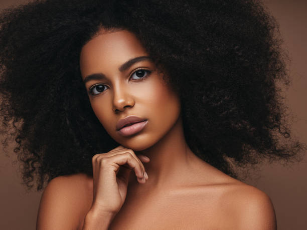 istock Beautiful smiling girl with curly hairstyle 1289340943