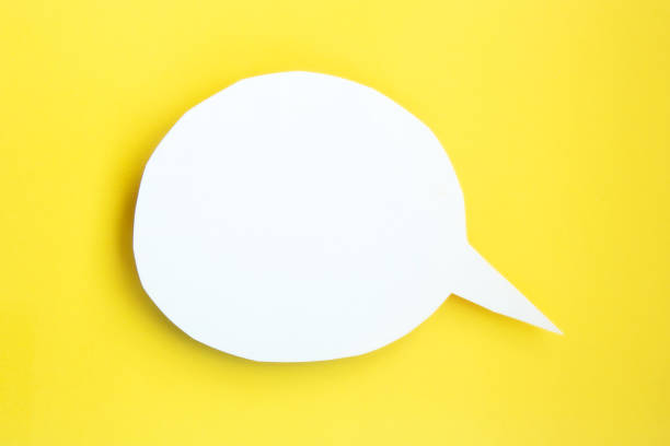 istock White paper speech bubble with clipping path on bright yellow background 1289341687