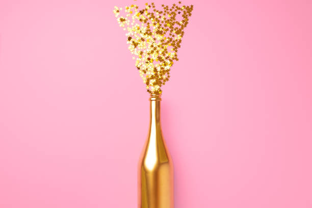istock Champagne bottle with confetti flat lay top view 1289342957