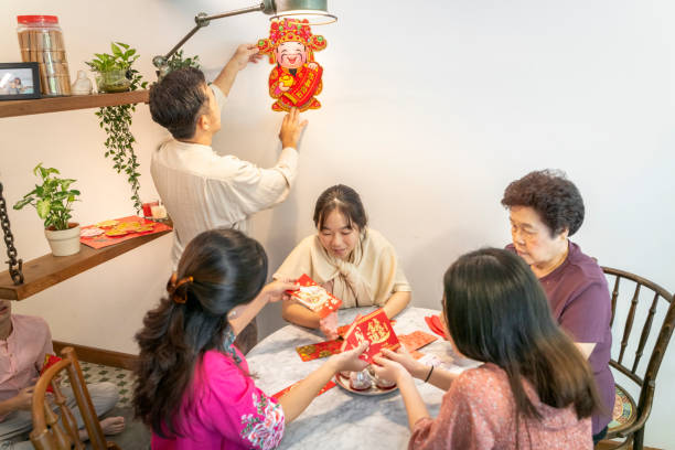 istock Asian Chinese preparing red packets at home 1289343996