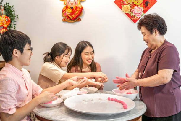 istock Making rice dumpling together on reunion day before Chinese New Year 1289344409