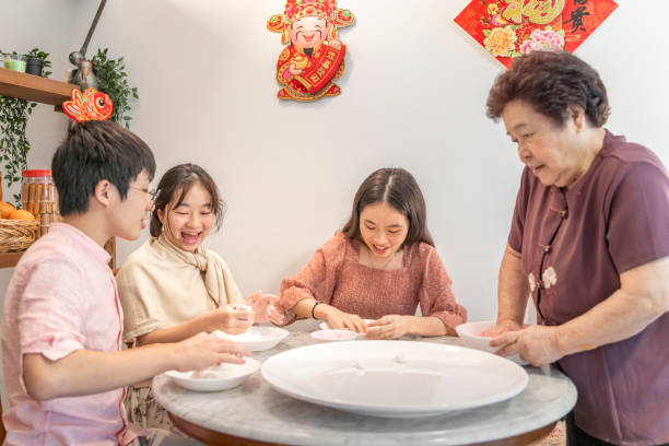 istock Making rice dumpling together on Chinese New Year 1289344483
