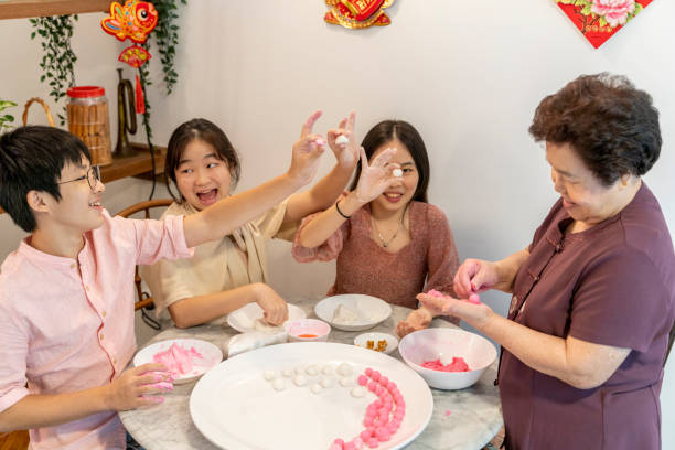 istock Making rice dumpling together on reunion day before Chinese New Year 1289344541