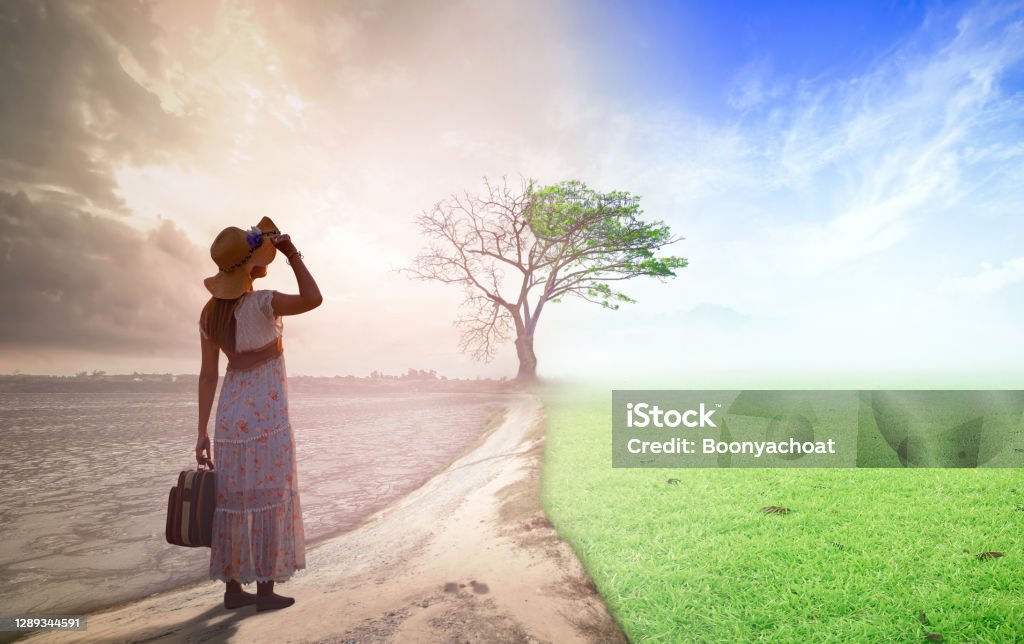 Climate worsened with good atmosphere concept Woman standing between climate worsened with good atmosphere Change Stock Photo