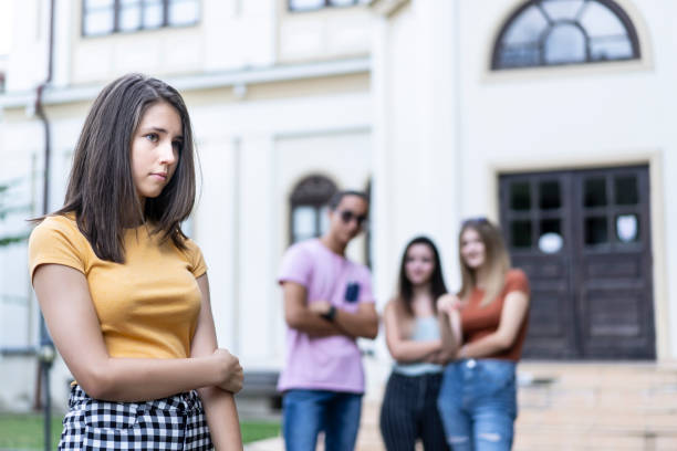 istock Classmates bullying a girl at schoolyard 1289344606
