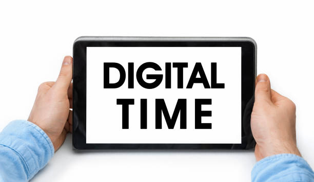 istock Closeup of a male hands holding tablet pc with text Digital Time 1289345305