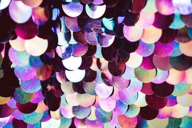 istock Shiny abstract background of semicircular multi-colored plastic elements of sequins texture fashion. Neon trend colors. 1289346725