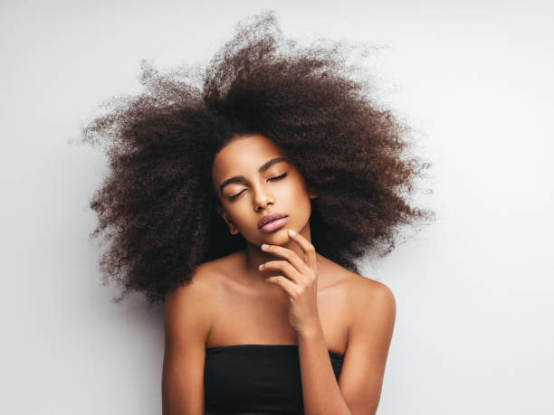istock Beautiful girl with curly hairstyle 1289347935