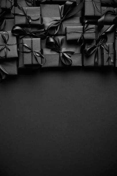 istock A pile various size black boxed gifts placed on stack. Christmas concept 1289348139