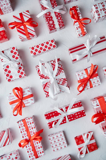 istock Various pattern and size Christmas boxes placed on white background. Wrapped in festive paper 1289348182