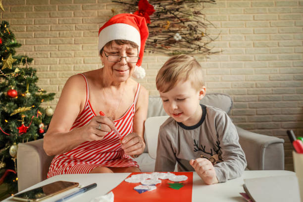 istock A Little boy with grandmom make greeting card. 1289350961