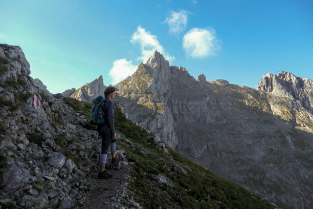 istock A top down view on the narrow trail along lose stones. There are sharp mountains and high peaks around. Dangerous mountain climbing. Bright day. Serenity and freedom. 1289351231