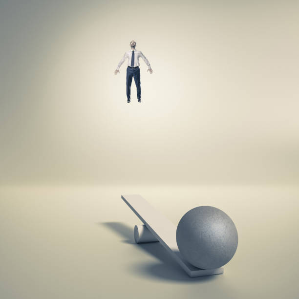istock businessman uses a catapult to fly upwards. 1289351336