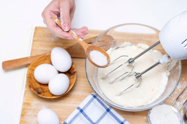 istock process of making dough for pancakes with ingredients on a light table, eggs and flour are whipped with a mixer 1289351397