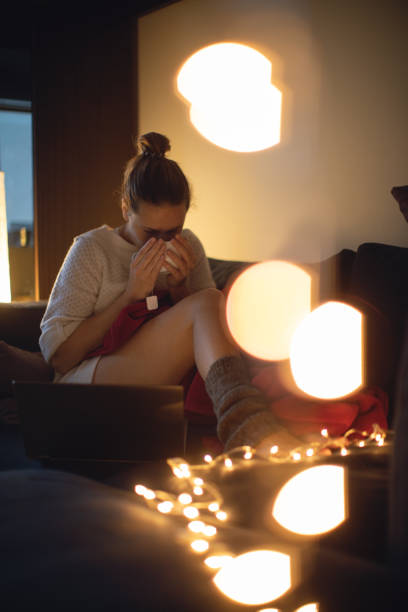 istock Woman drinking tea alone at home 1289351413