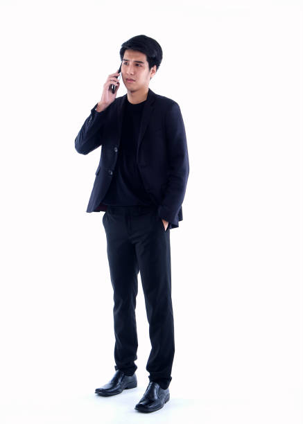 istock Handsome man talking on phone over white background 1289352441