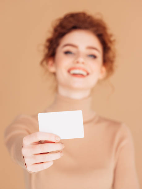 istock Beautiful woman holds placard 1289358305