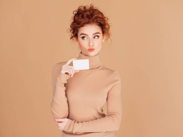 istock Beautiful woman holds placard 1289358350