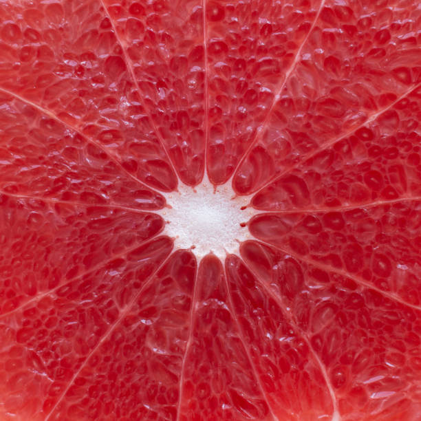 istock background texture of a slice of grapefruit, top view closeup 1289358386