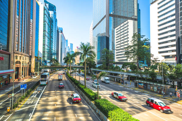 istock Hong Kong traffic zooming through skyscraper avenue 1289358611