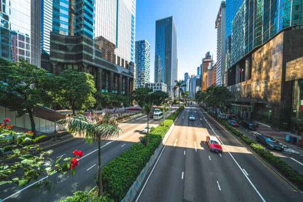 istock Hong Kong traffic zooming through skyscraper avenue 1289358612