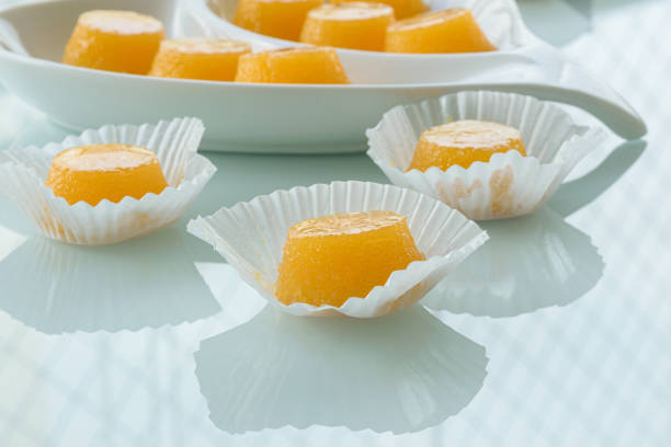istock Three quindins on a reflective surface. Traditional sweet from northeastern Brazil. 1289359271