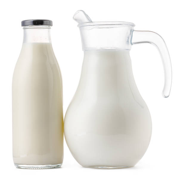istock Glassware full of fresh milk isolated on white 1289360329