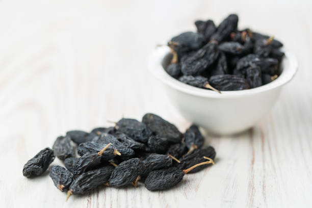 istock Dried fruits, raisins on white background 1289362596