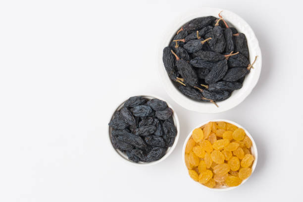 istock Dried fruits, raisins on white background 1289362663