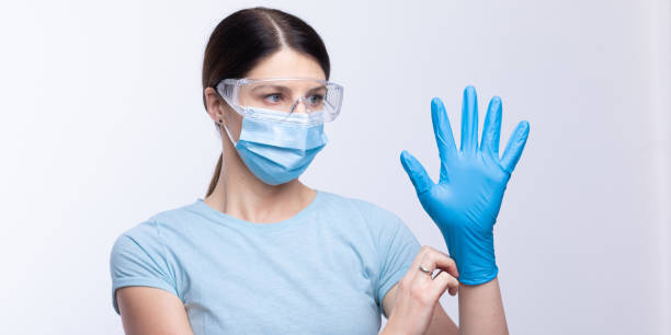 istock Nurse or doctor wearing and checking protective equipment against viruses and bacterial disease 1289362733
