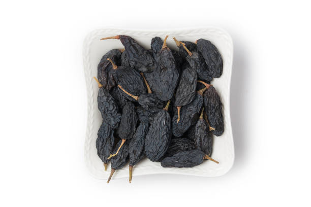 istock Dried fruits, raisins on white background 1289362753