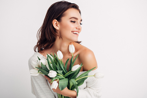 Happy woman with bouquet of tulips
